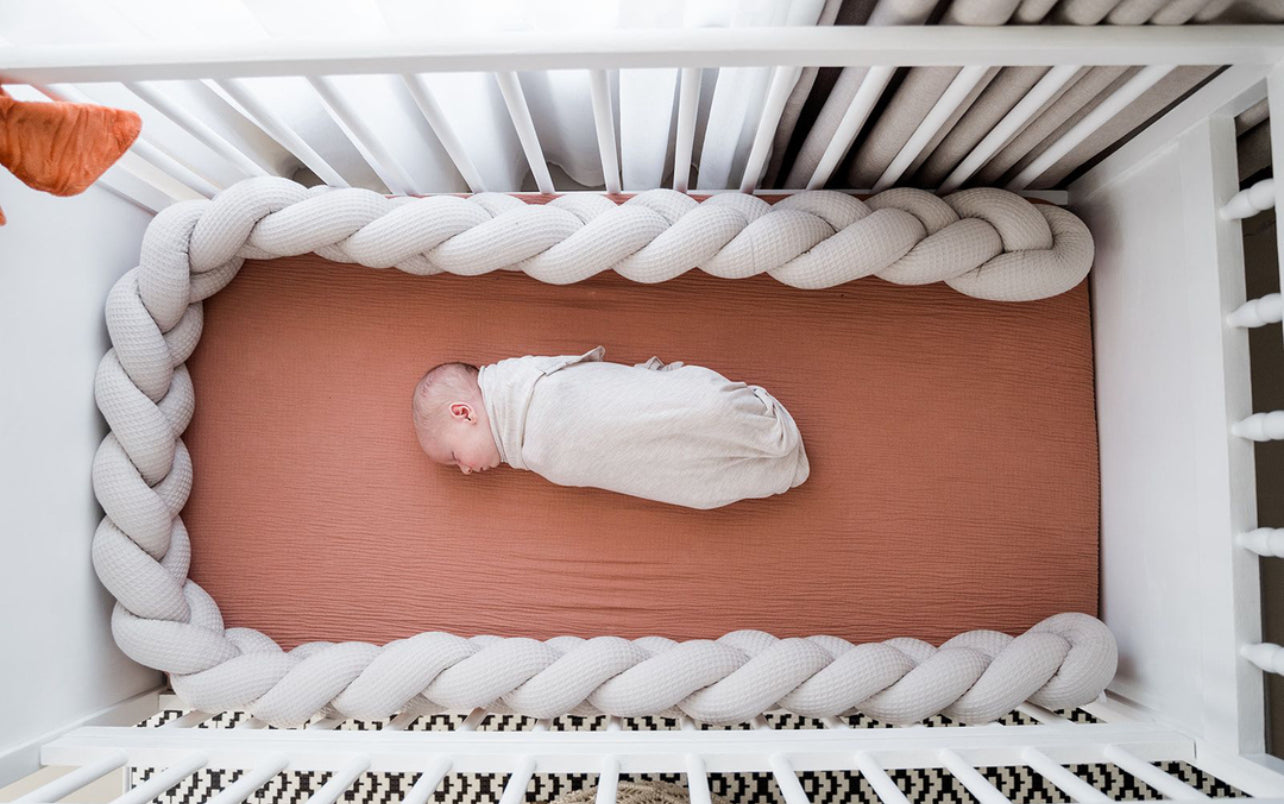 Koosh-uhn Waffle Braided Cot Bumper