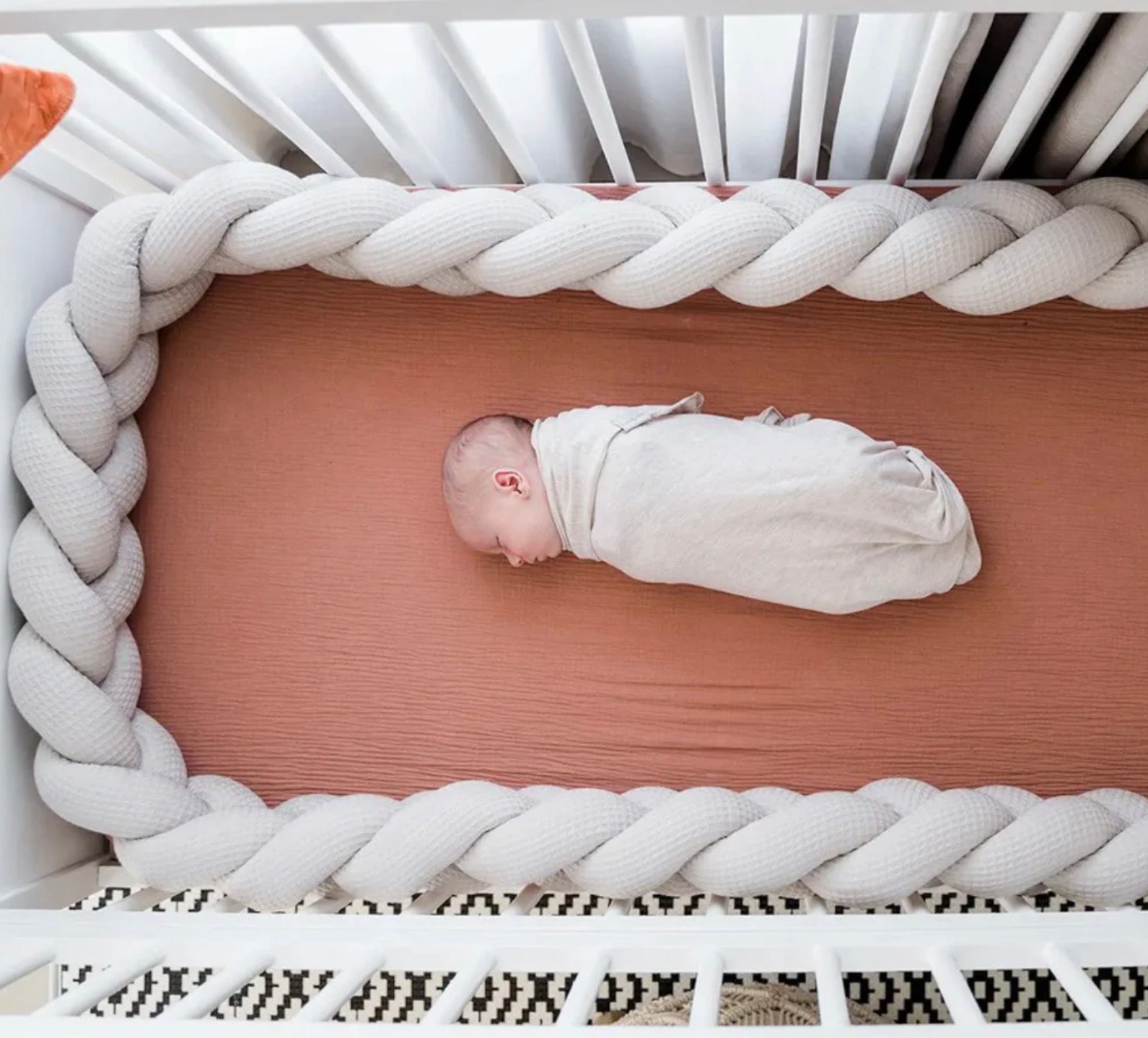 Koosh-uhn Waffle Braided Cot Bumper